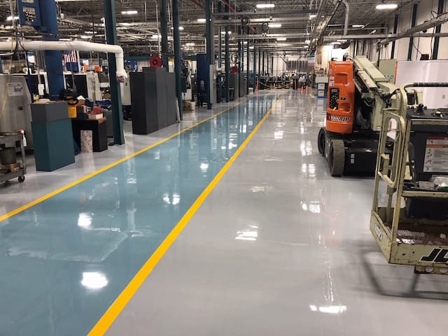 Commercial and industrial epoxy flooring system in a professional workspace