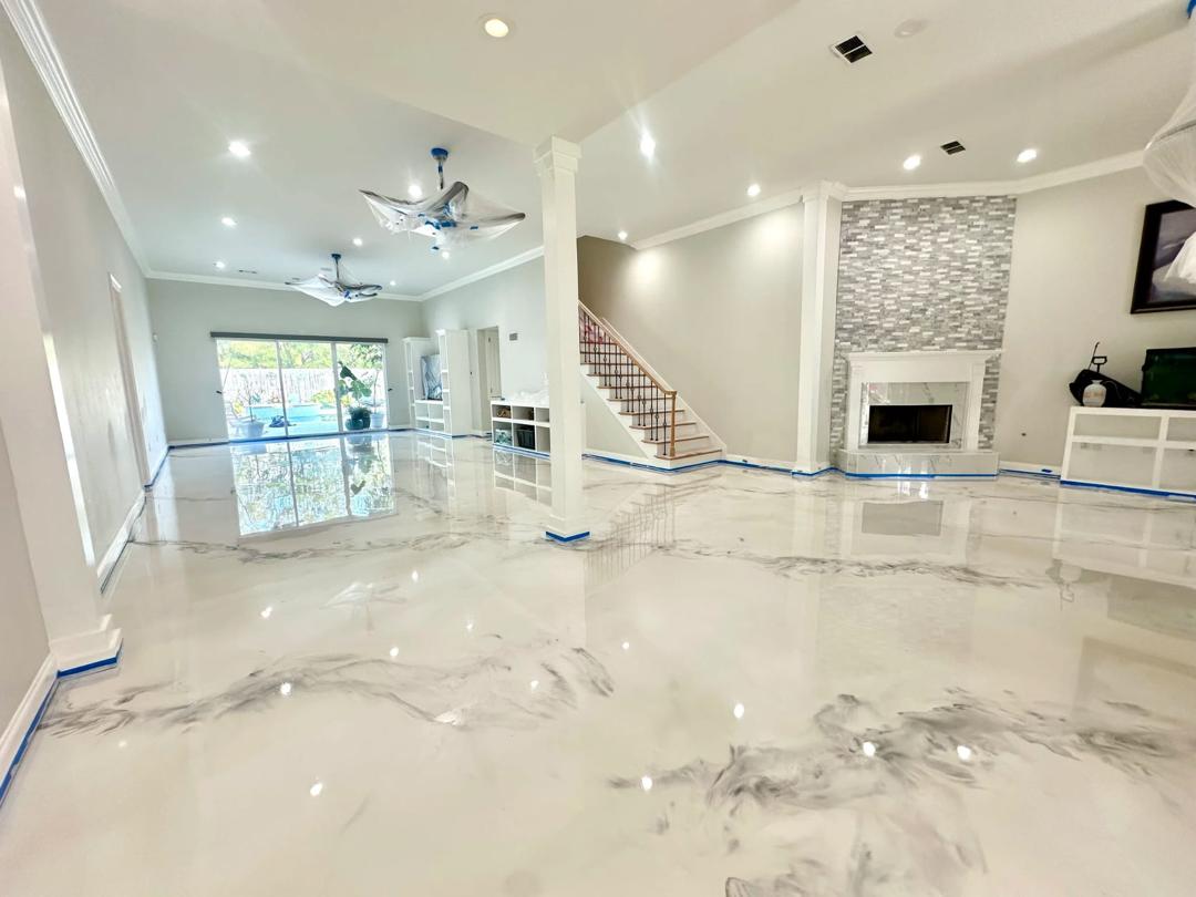 White marble-style epoxy floor in a residential living room