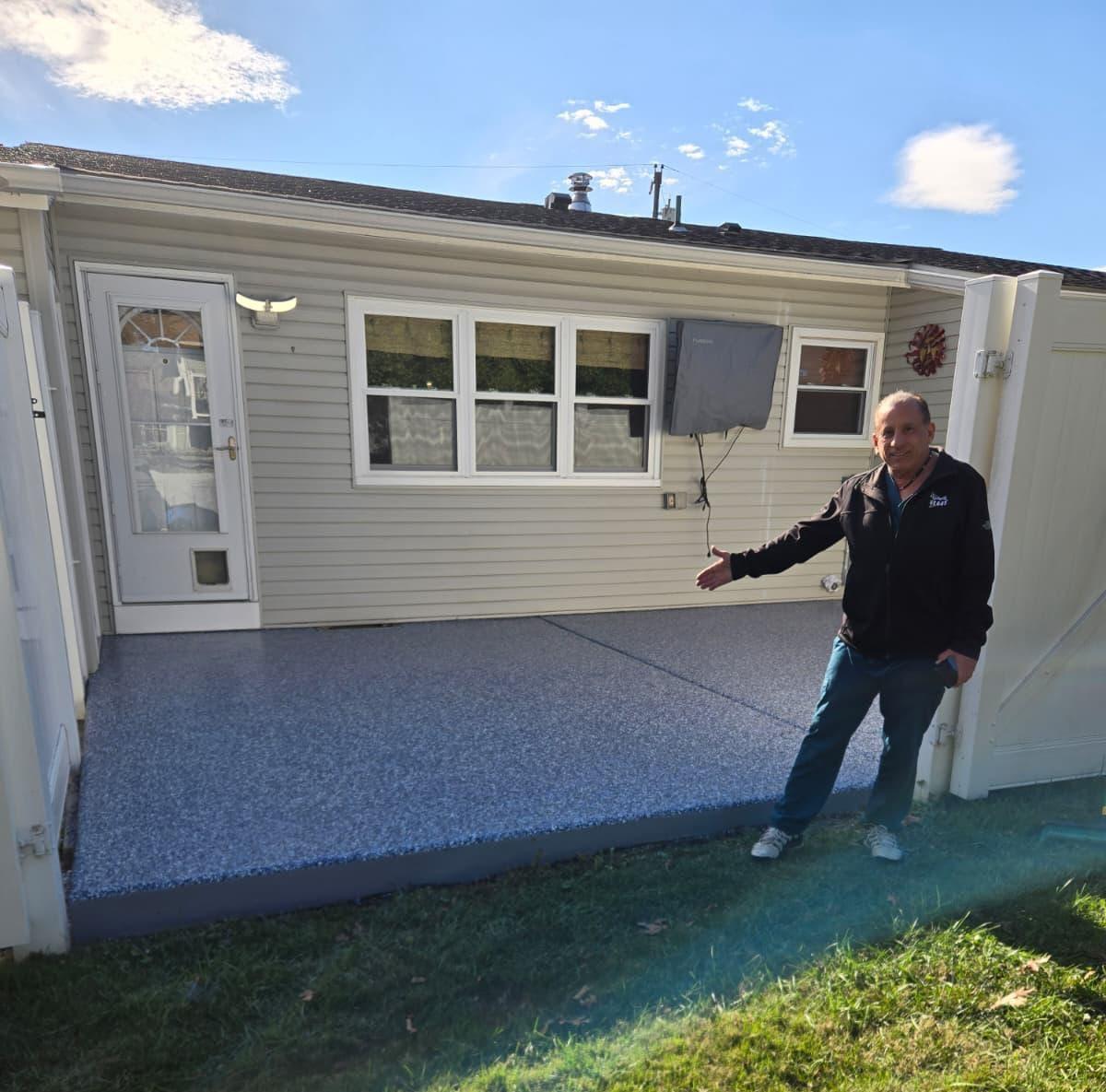 David Falo showing his finished epoxy floor in Gibbsboro, New Jersey